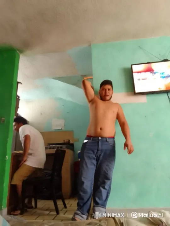 Shirtless Man Enthusiastically Dancing in Colorful Room – AI Generated Video | Hailuo AI