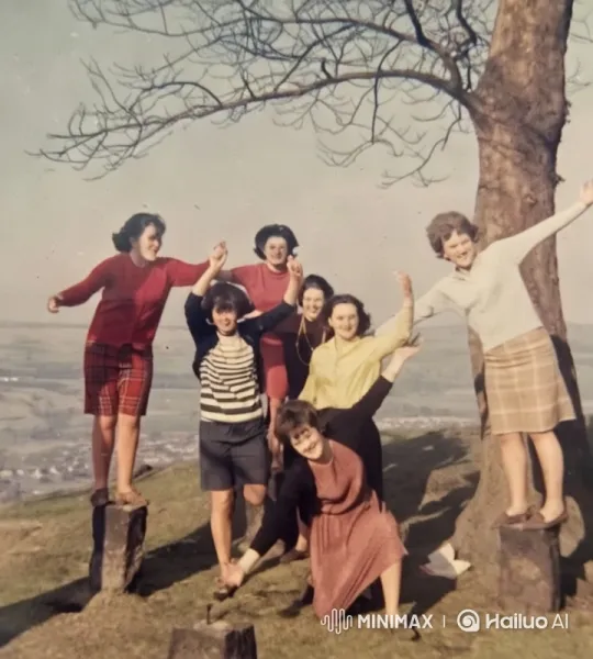 Vibrant Group Poses on Hilltop with Panoramic View – AI Generated Video | Hailuo AI