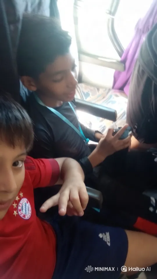 Affectionate Moment Between Two Boys on a Bus – AI Generated Video | Hailuo AI
