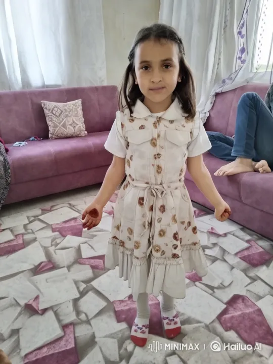 Young Girl in Floral Dress in Cozy Living Room – AI Generated Video | Hailuo AI