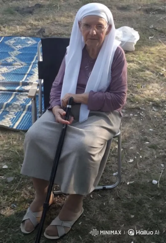 Elderly Woman Smiles, Waves in Serene Outdoor Setting – AI Generated Video | Hailuo AI
