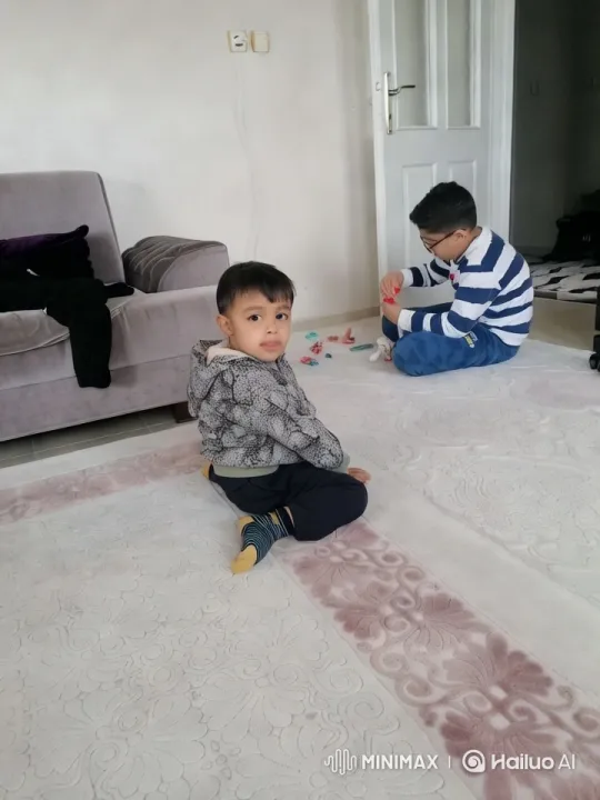 Boy Enthusiastically Waves Amid Cozy Home Setting – AI Generated Video | Hailuo AI