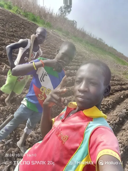 Boys Pose with Peace Signs in Plowed Field – AI Generated Video | Hailuo AI