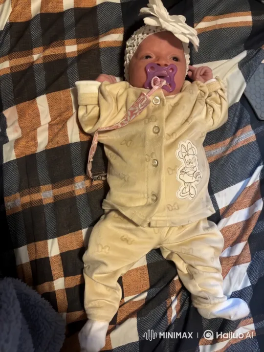 Baby with AR Gun on Plaid Blanket – AI Generated Video | Hailuo AI