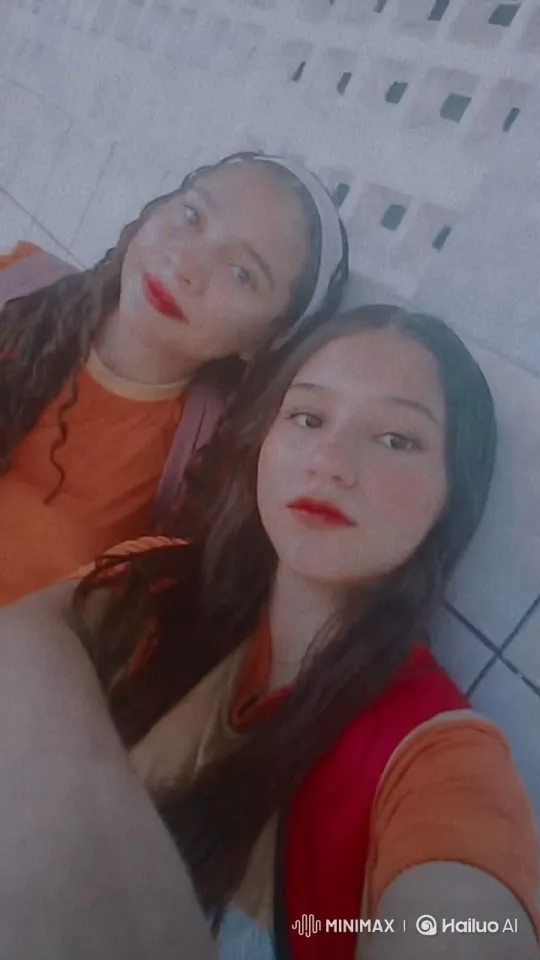 Orange Shirted Duo in Braids with Dynamic Camera Angles – AI Generated Video | Hailuo AI