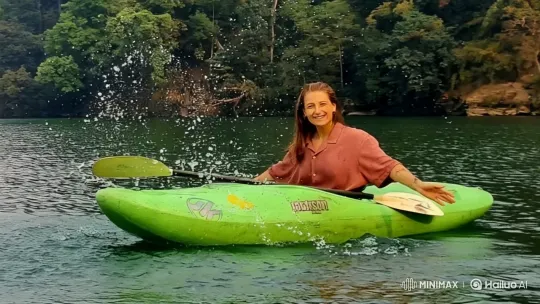 Kayaker Navigates Tranquil River Amidst Lush Greenery – AI Generated Video | Hailuo AI