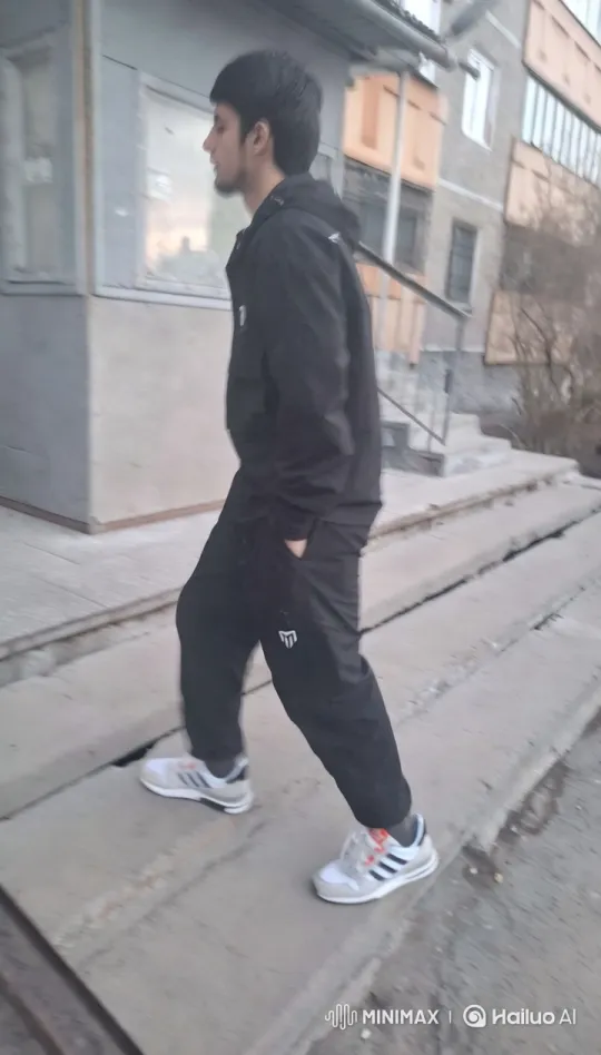Young Man Walking Through Urban Residential Area – AI Generated Video | Hailuo AI