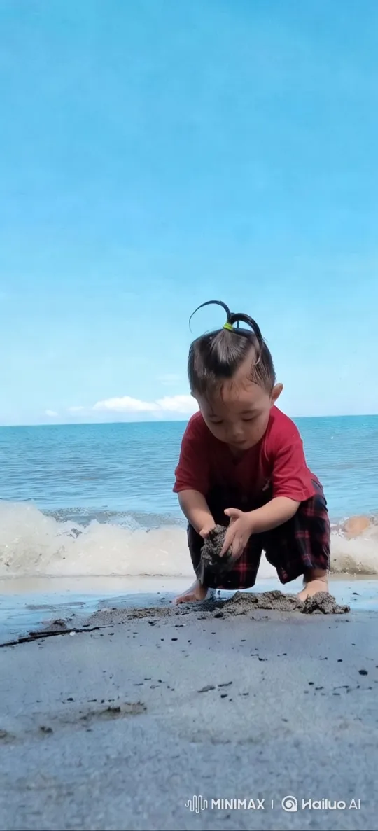Child Playing on Sandy Beach with Waves – AI Generated Video | Hailuo AI