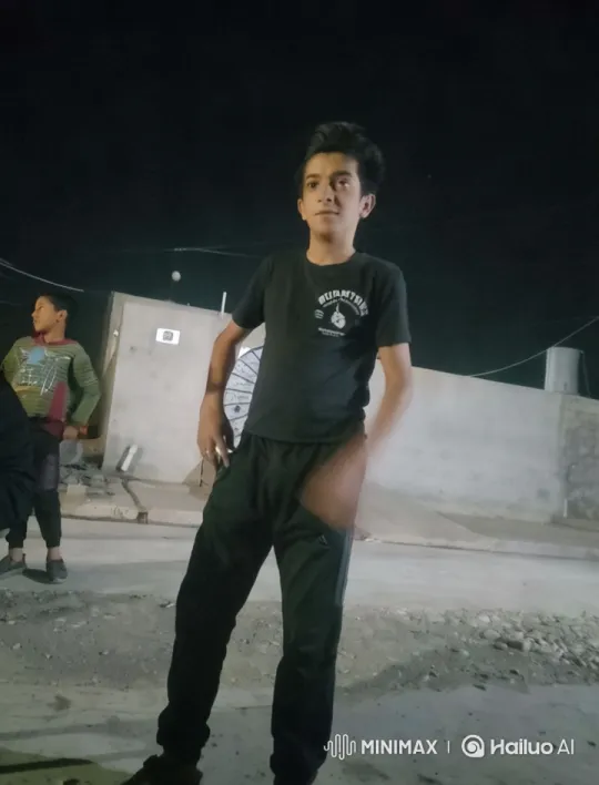 Confident Young Boy in Dark Scene with Soft Lighting – AI Generated Video | Hailuo AI