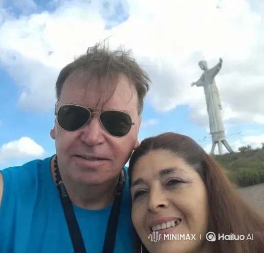 Couple Kisses with Christ the Redeemer in Background – AI Generated Video | Hailuo AI
