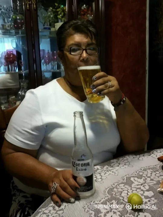 Woman Toasts with Golden Drink Amidst Elegant Setting – AI Generated Video | Hailuo AI