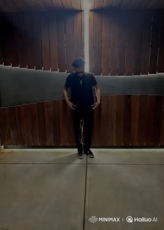Young Man Surprised by Ice Pour in Minimalist Setting – AI Generated Video | Hailuo AI