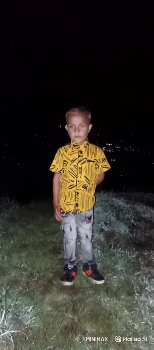 Boy in Yellow Shirt at Night: Serene Visuals – AI Generated Video | Hailuo AI
