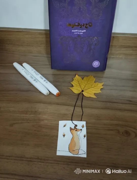 Artistic Display of Book, Leaf, and Card on Wooden Surface – AI Generated Video | Hailuo AI