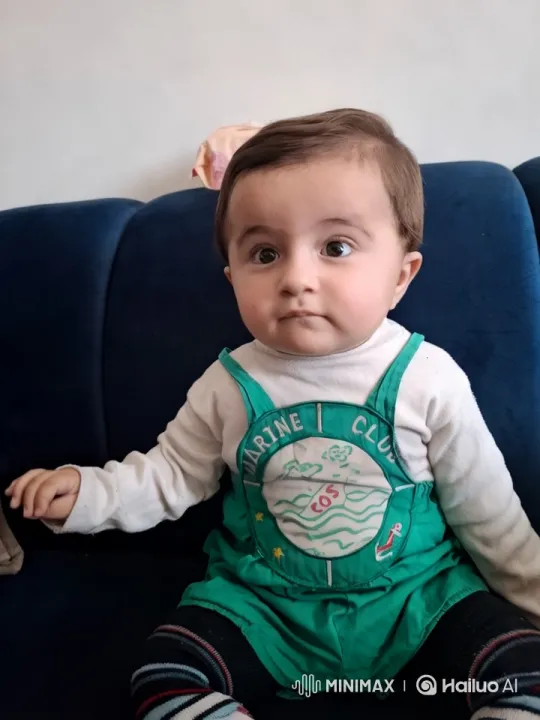Baby Playing 3D-Printed Guitar on Sofa – AI Generated Video | Hailuo AI