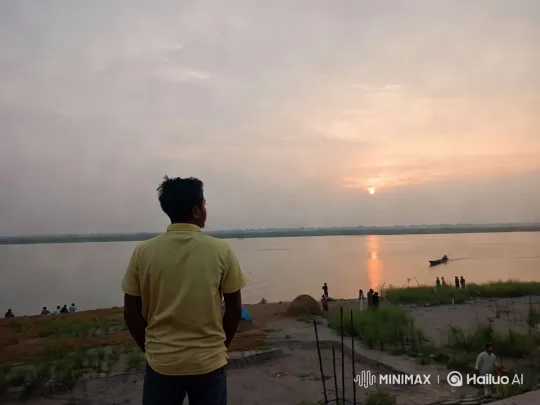 Tranquil Sunset: Contemplation by the River – AI Generated Video | Hailuo AI
