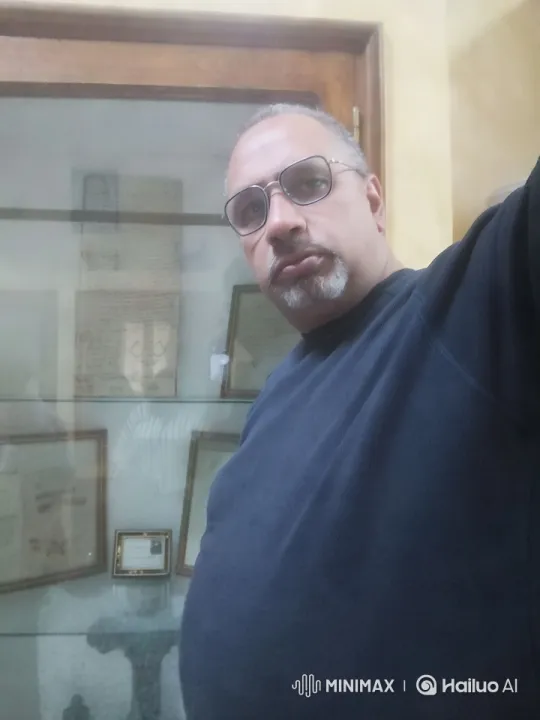 Close-up of Person and Display Case in Warm Lighting – AI Generated Video | Hailuo AI