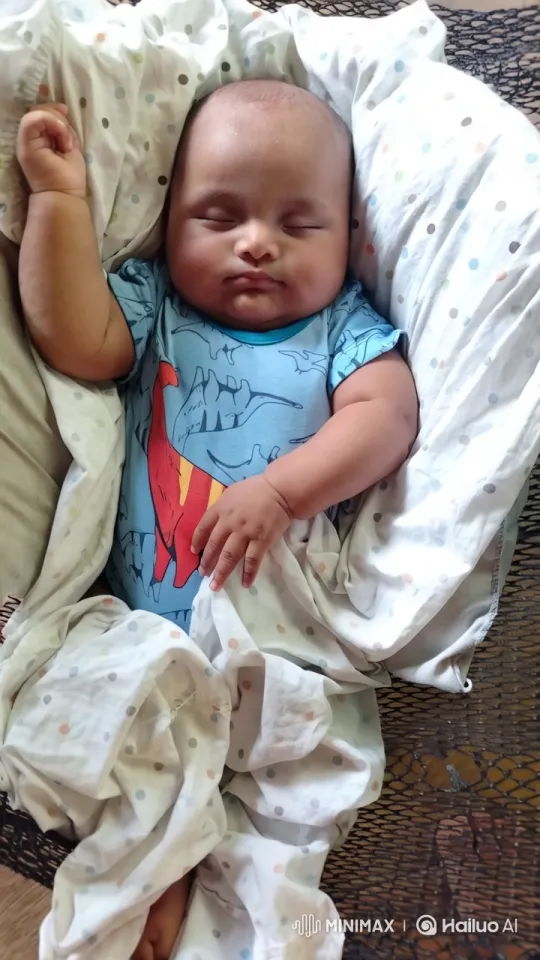Cozy Baby in Dinosaur Onesie on Soft Blanket – AI Generated Video | Hailuo AI