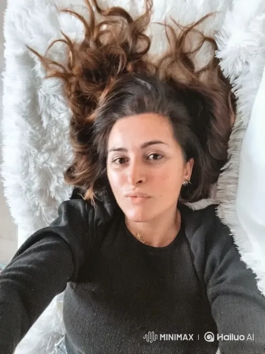 Serene Portrait of a Woman in Soft Light – AI Generated Video | Hailuo AI