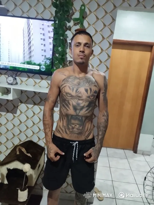Confident Bodybuilder Showcases Tattoos in Stylish Setting – AI Generated Video | Hailuo AI