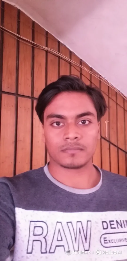 Young Man Showcases Raw Denim Shirt in Cozy Setting – AI Generated Video | Hailuo AI