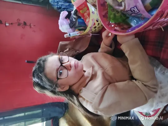 Young Girl Examines Toys and Snacks in Cozy Room – AI Generated Video | Hailuo AI
