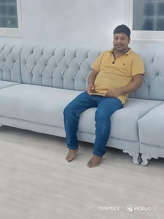 Modern Living Room with Relaxed Man – AI Generated Video | Hailuo AI