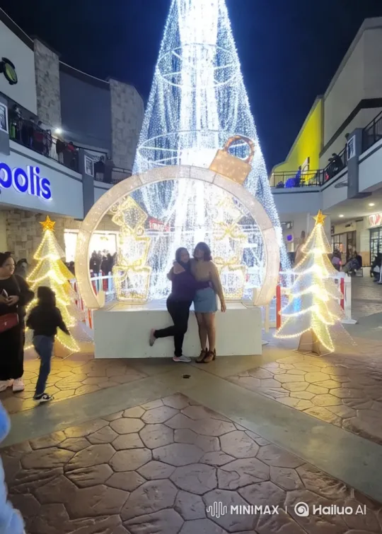 Holiday Shopping Center with Christmas Tree and Cheerful Shoppers – AI Generated Video | Hailuo AI