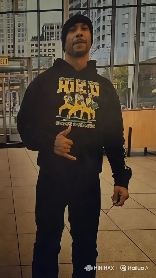 Modern Indoor Scene with Man in HBCU Cross Colours Hoodie – AI Generated Video | Hailuo AI
