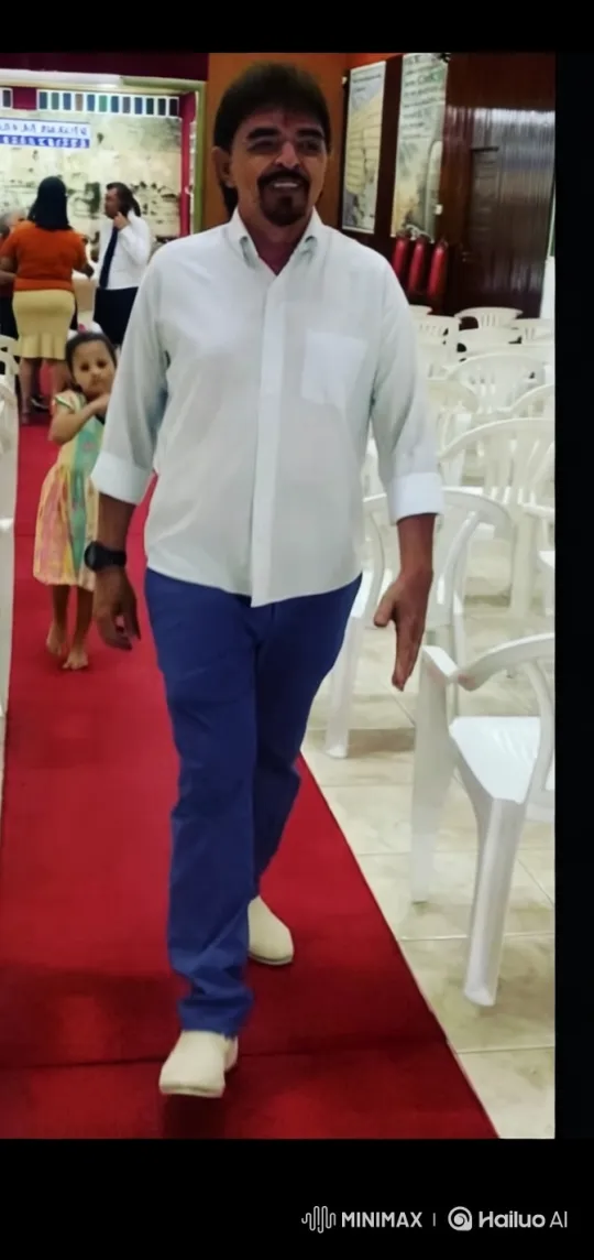 Man Walks Down Red Carpet in Polished Hall – AI Generated Video | Hailuo AI