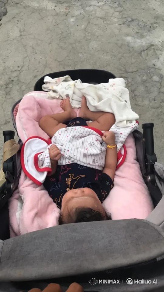Innocent Joy: Baby's Playful Dance in Stroller – AI Generated Video | Hailuo AI