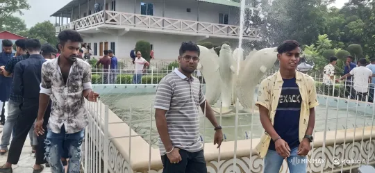 Young Men Around Decorative Fountain in Garden Setting – AI Generated Video | Hailuo AI