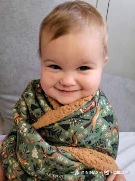 Baby in Cozy Forest-Themed Blanket Amid Serenity – AI Generated Video | Hailuo AI