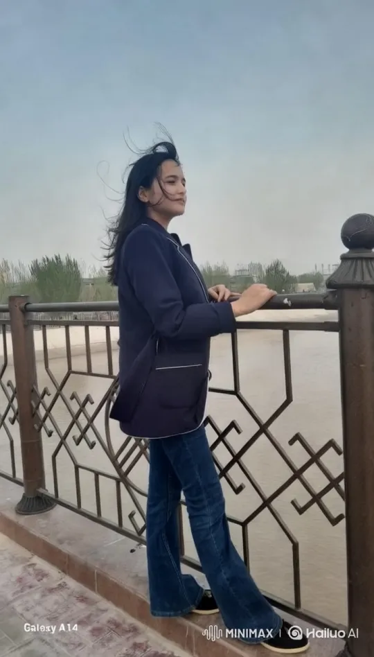 Young Woman on Bridge Over Serene River – AI Generated Video | Hailuo AI