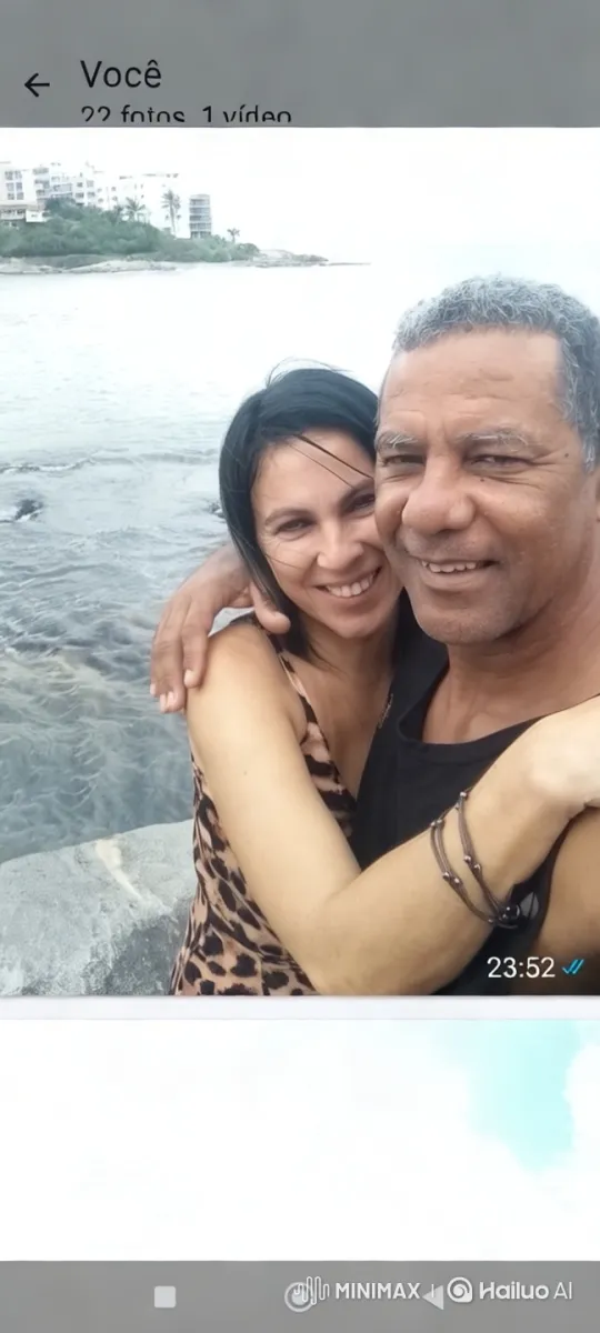 Couple Embraces on Rocky Seaside with Overcast Sky – AI Generated Video | Hailuo AI