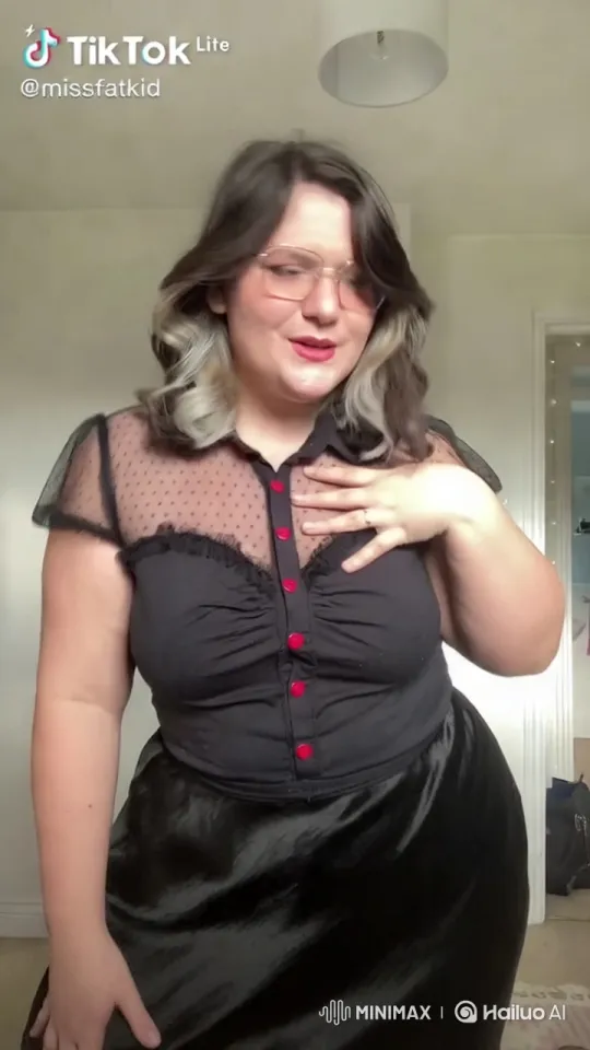 Elegant Woman Showcasing Her Satin Dress in a Well-Lit Room – AI Generated Video | Hailuo AI