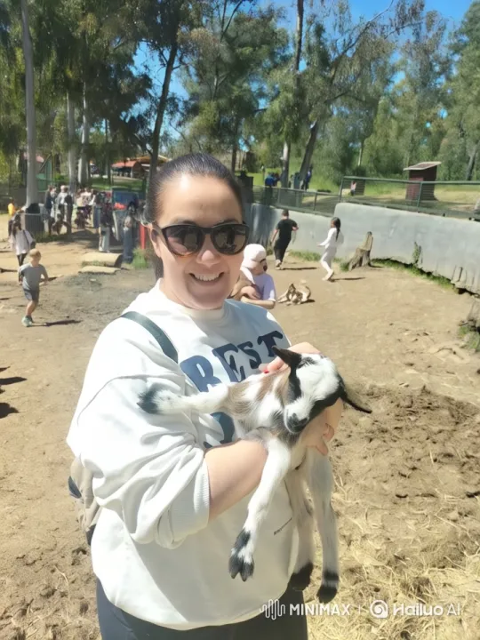 Flamenco Dancer Enchants with Baby Goat in Joyful Outdoor Scene – AI Generated Video | Hailuo AI