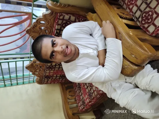Man in White on Ornate Chair: Cozy Dance-Inviting Setting – AI Generated Video | Hailuo AI
