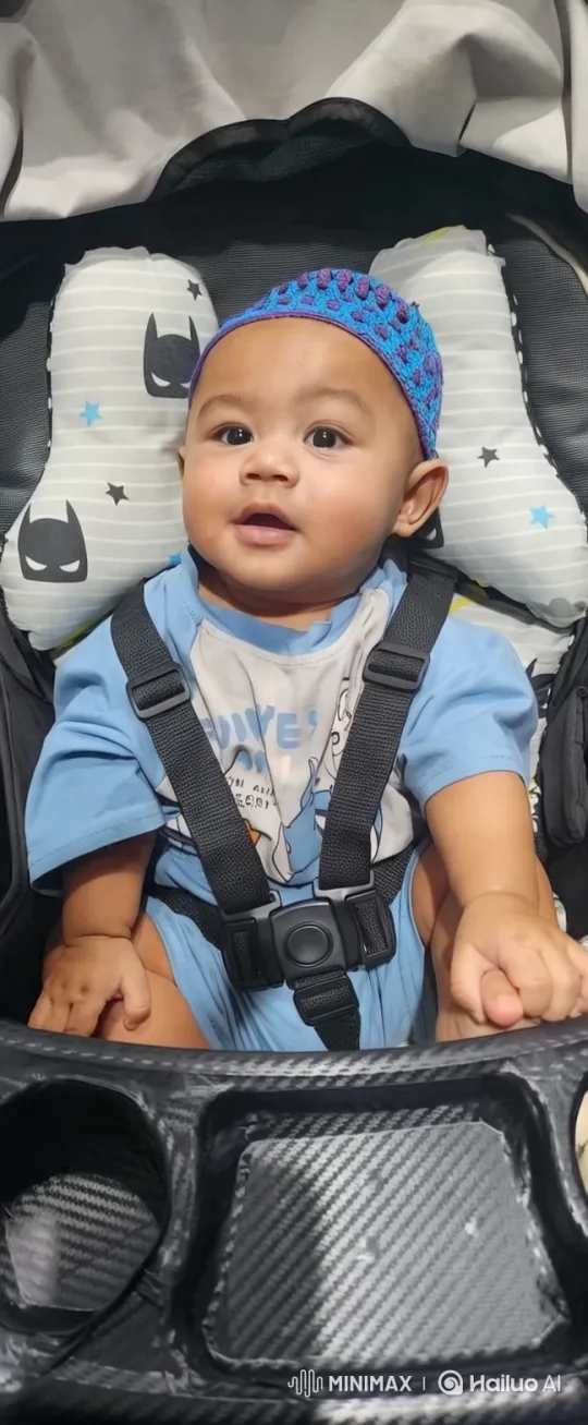 Baby in Batman Stroller: Close-up to Tracking Shot – AI Generated Video | Hailuo AI