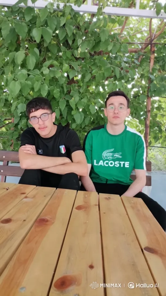 Young Men Share Intimate Moment Under Green Canopy – AI Generated Video | Hailuo AI