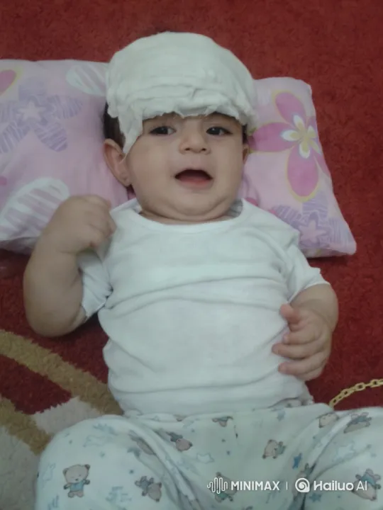 Baby's Tender Recovery on Colorful Carpet – AI Generated Video | Hailuo AI