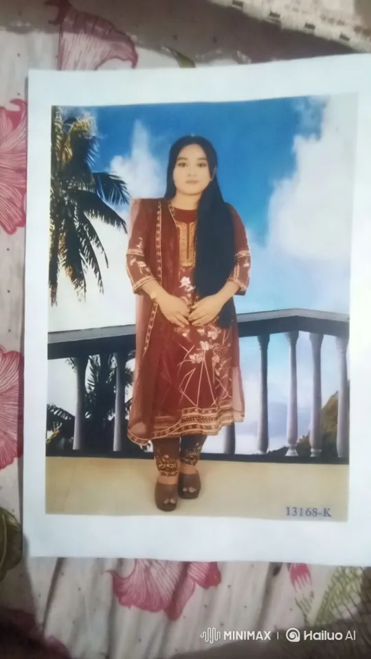 Woman in Maroon Embroidered Dress with Scenic Background – AI Generated Video | Hailuo AI