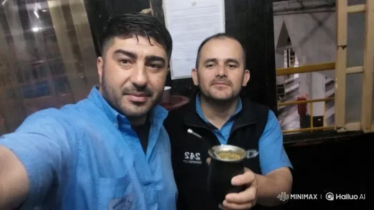 Industrial Setting with Men and Traditional Mate Cup – AI Generated Video | Hailuo AI
