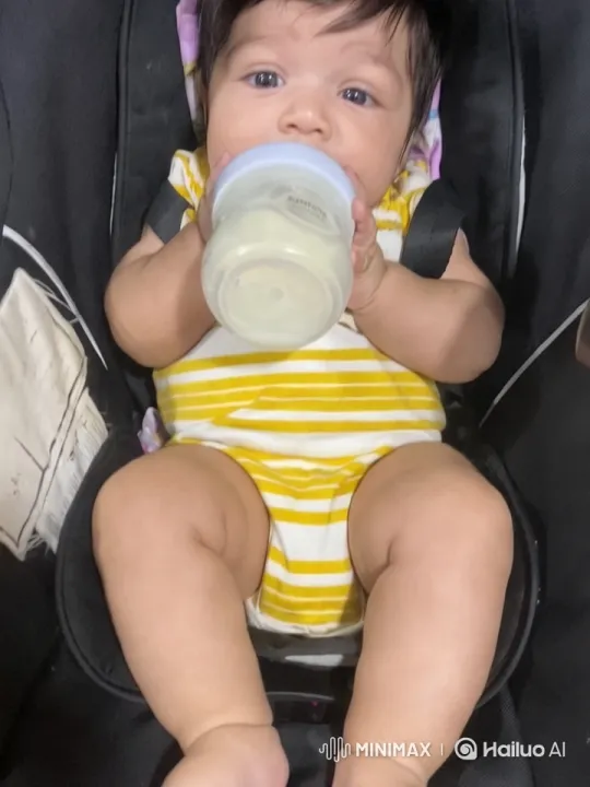 Baby Enjoying Milk in Striped Onesie - Close-up to Panorama – AI Generated Video | Hailuo AI