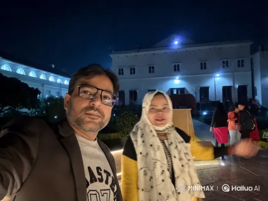 Grand Building Illuminates Night Scene with Couple – AI Generated Video | Hailuo AI