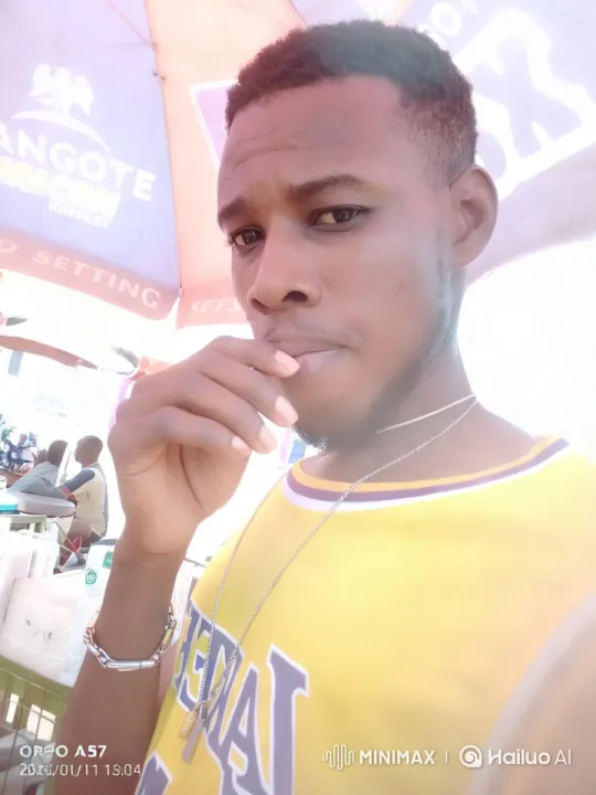 Young Man in Yellow Jersey at Lively Outdoor Scene – AI Generated Video | Hailuo AI