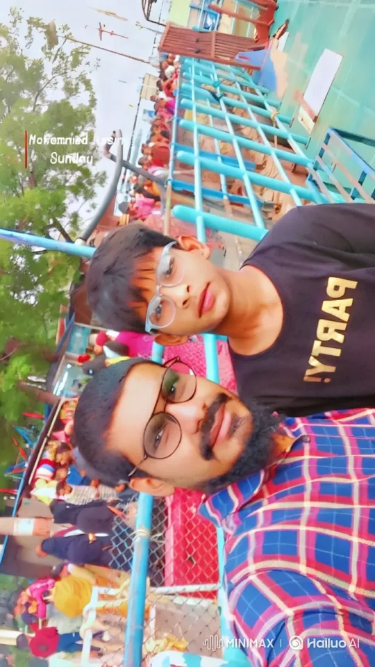 Father and Son Joyfully Dancing at Amusement Park – AI Generated Video | Hailuo AI