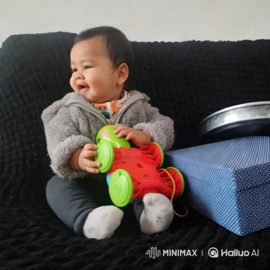 Baby Dancing with Toy Car on Couch – AI Generated Video | Hailuo AI