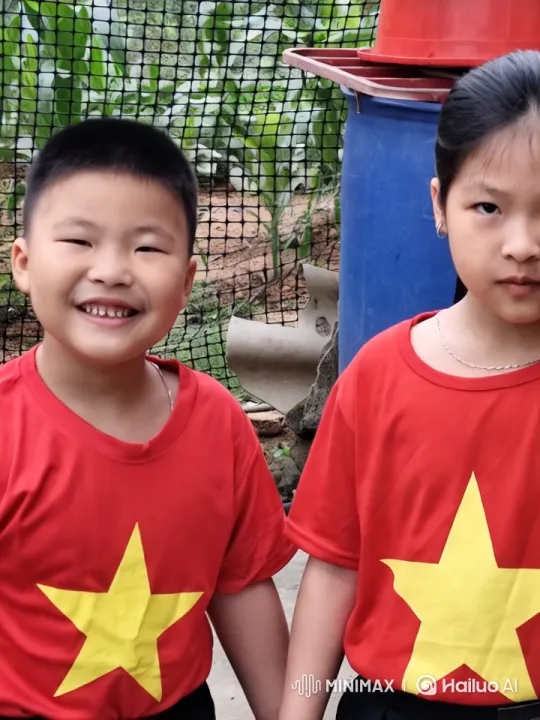 Children in Red Shirts Hold Hands in Garden – AI Generated Video | Hailuo AI