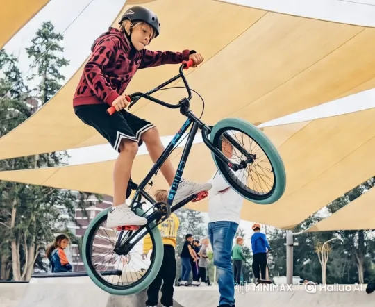 Urban Skate Park: Young BMX Rider's Impressive Jump – AI Generated Video | Hailuo AI